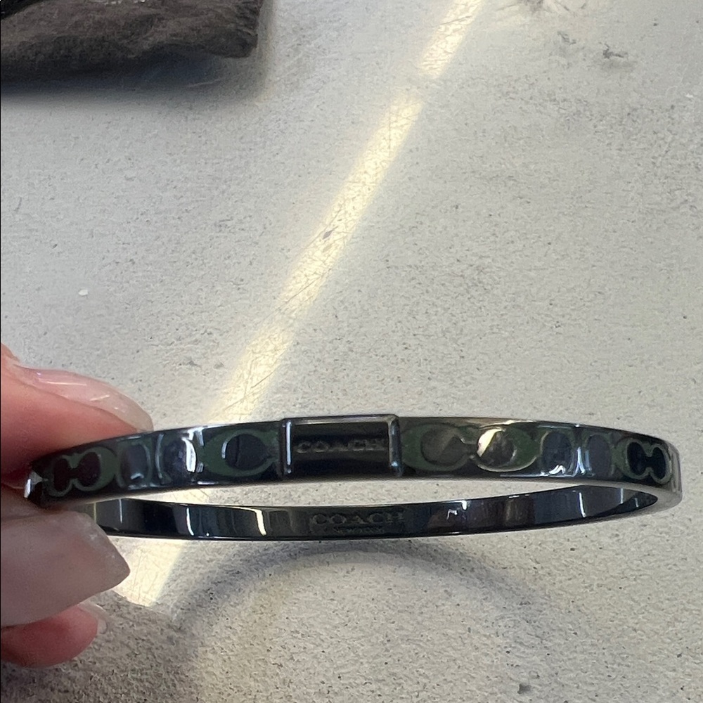 Coach bangle in gunmetal and olive